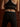 Rear view of the Varley Always Jay Bra in Black/Snow White, worn with matching contrast-trim leggings