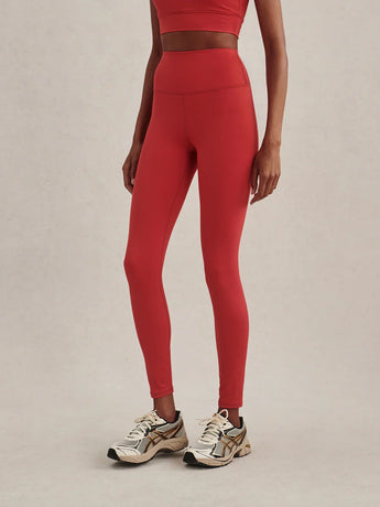 Front view of Varley FreeSoft High Rise Leggings in Pink Begonia, showing the wide waistband and fitted legs.
