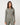 TravisMathew Pulse Half Zip in Olive Smoke, front view showing fitted shape, long sleeves and ribbed texture.