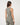 TravisMathew Pulse Tank in Olive Smoke, rear three-quarter view showing high back and cropped fit.