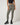 TravisMathew Pulse Legging in Olive Smoke, front view showing high-rise waistband and full-length fitted legs.
