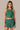 Front view of the J. Pritchard Women's Quiet Lux Tank in Pritchard Green with a matching pleated skirt.