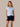 Front view of a model wearing the J. Pritchard Drift Short Sleeve Tee in Heather Sky Blue with navy drawstring shorts