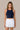 Front view of the J. Pritchard Women's Quiet Lux Tank in Bainbridge Blue, showing its high neckline and cropped hem.