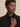 Close-up of the high collar and concealed front fastening on the black Varley Anset Jacket