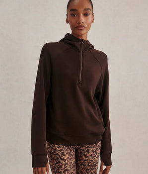 Varley Karo Half Zip Hooded Sweat in Coffee Bean, showing its zipped neckline, raglan sleeves and relaxed fit