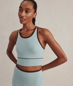 Varley Always Jay Bra in Tourmaline, showing its high neckline, dark contrast trim and wide underband.