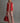 Model wearing the Varley Lilah Cord Puffer Gilet in Pink Begonia over a pale pink outfit, front full-length view.