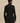 Back view of the black Varley Anset Jacket, showing its fitted waist, long sleeves and hip-covering length.