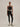 Full outfit view: Model wearing Varley Always Contrast High Rise Legging 25 in Black/Snow White with a matching contrast-trim sports bra.