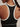 Close-up of the Varley Always Jay Bra in Black/Snow White, showing white racerback trim and a small Varley logo