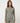 TravisMathew Pulse Half Zip in Olive Smoke, front view showing fitted shape, long sleeves and ribbed texture.