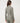 TravisMathew Pulse Half Zip in Olive Smoke, back view showing fitted silhouette and stand collar.