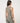 TravisMathew Pulse Tank in Olive Smoke, rear three-quarter view showing high back and cropped fit.