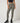 TravisMathew Pulse Legging in Olive Smoke, front view showing high-rise waistband and full-length fitted legs.