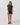 Full-length front view of the Vuori Energy Classic Tee in Hemlock Heather styled with black fitted shorts and sneakers.