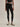 Front view of Varley Always Contrast High Rise Legging 25 in Black/Snow White, showing the white contrast waistband and cropped leg length.