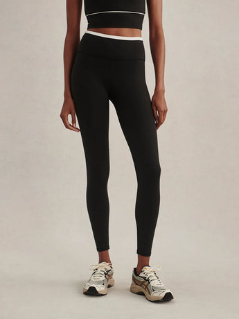 Front view of Varley Always Contrast High Rise Legging 25 in Black/Snow White, showing the white contrast waistband and cropped leg length.